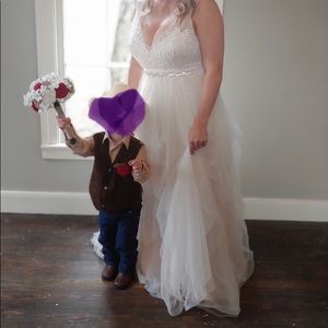 Wedding dress size 14. Altered for train hook up.